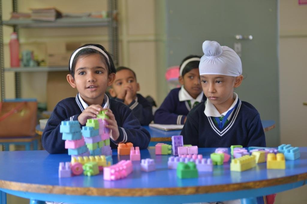 Students engaged in learning activities at Atma Malik Campus